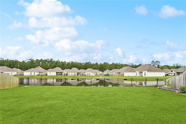 11557 Woodbluff Dr, Covington, LA 70433 - view of yard with a residential view and a water view