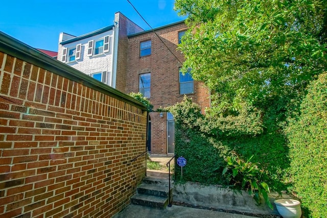 1032 7th St, New Orleans, LA 70115 - view of side of home featuring brick siding
