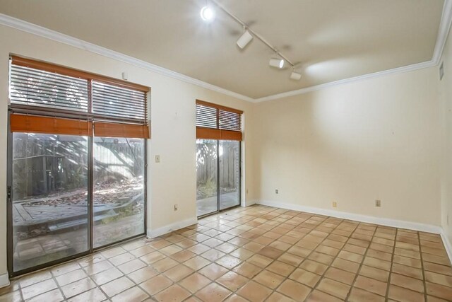 1032 7th St, New Orleans, LA 70115 - tiled spare room with track lighting and crown molding