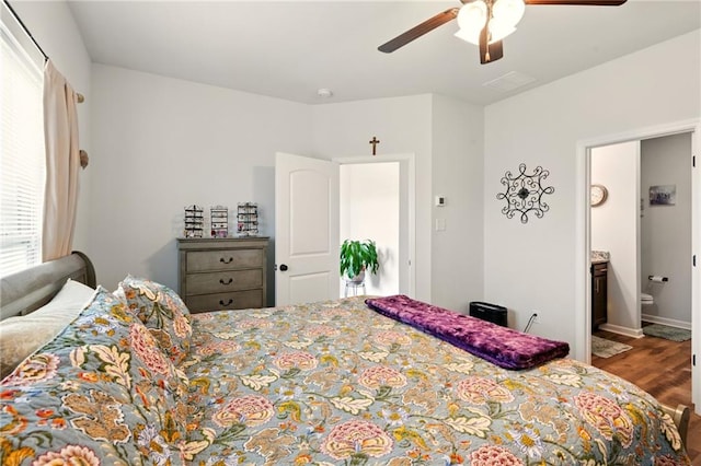 23406 Ruger Dr, Denham Springs, LA 70726 - bedroom featuring wood finished floors, ceiling fan, and connected bathroom