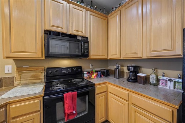 4000 Lake Beau Pre Blvd Unit 100, Baton Rouge, LA 70820 - kitchen featuring black appliances and light brown cabinetry
