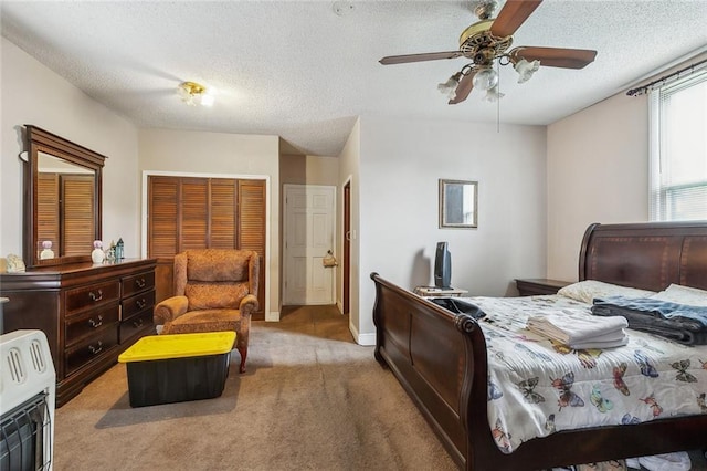 925 N Prieur St, New Orleans, LA 70116 - bedroom featuring carpet floors, heating unit, a textured ceiling, and ceiling fan