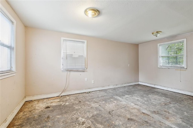 925 N Prieur St, New Orleans, LA 70116 - spare room featuring baseboards and a textured ceiling