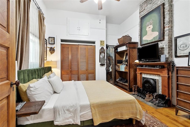 324 Angela St, Arabi, LA 70032 - bedroom with wood finished floors, a closet, and ensuite bathroom