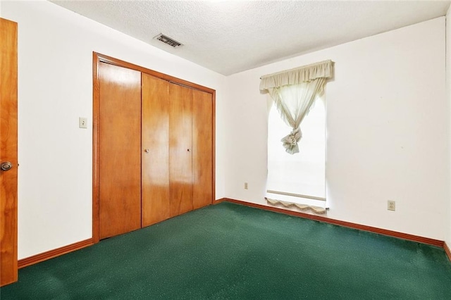 1500 Hudson St, Kenner, LA 70062 - unfurnished bedroom featuring carpet, a textured ceiling, a closet, and baseboards