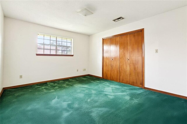 1500 Hudson St, Kenner, LA 70062 - unfurnished bedroom with carpet, baseboards, and a closet
