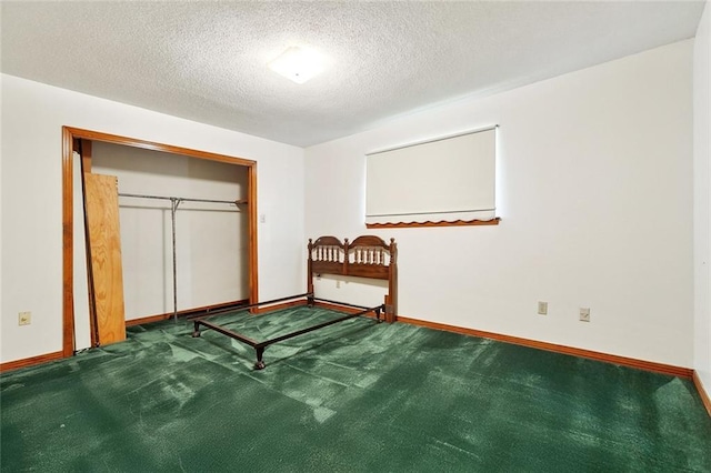1500 Hudson St, Kenner, LA 70062 - carpeted bedroom with a textured ceiling, baseboards, and a closet