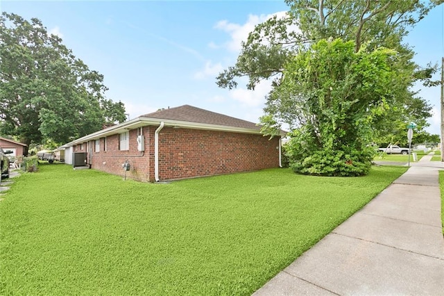 1500 Hudson St, Kenner, LA 70062 - view of property exterior with brick siding and a lawn