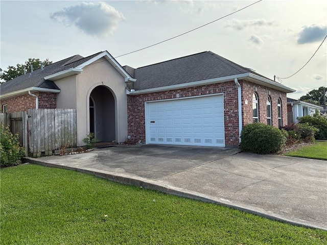 4636 Meadowdale St, Metairie, LA 70006 - ranch-style house featuring an attached garage, concrete driveway, brick siding, roof with shingles, and stucco siding