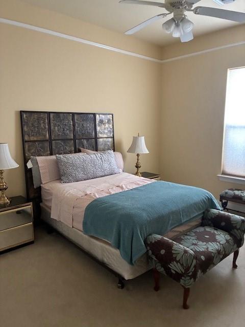 4636 Meadowdale St, Metairie, LA 70006 - carpeted bedroom featuring a ceiling fan