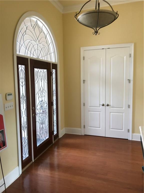 4636 Meadowdale St, Metairie, LA 70006 - foyer with wood finished floors, baseboards, and crown molding