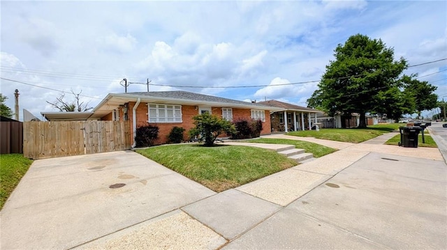 2112 Munster Blvd, Meraux, LA 70075 - ranch-style house featuring brick siding and driveway