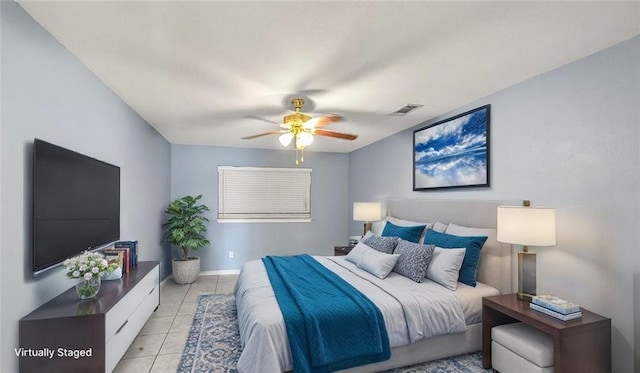2112 Munster Blvd, Meraux, LA 70075 - bedroom featuring light tile patterned floors, a ceiling fan, and baseboards