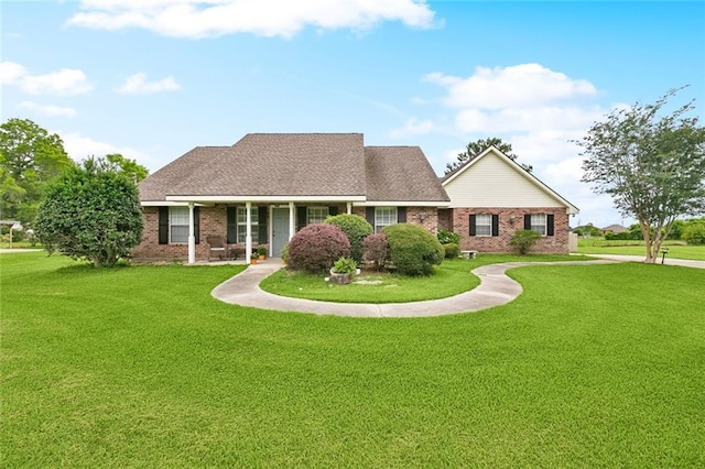 7045 River Rd, Waggaman, LA 70094 - view of front of home with a front lawn and brick siding