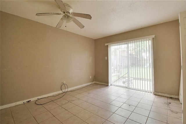 461214 Grammar Ave, Metairie, LA 70001 - unfurnished room featuring ceiling fan, light tile patterned flooring, baseboards, and a textured ceiling