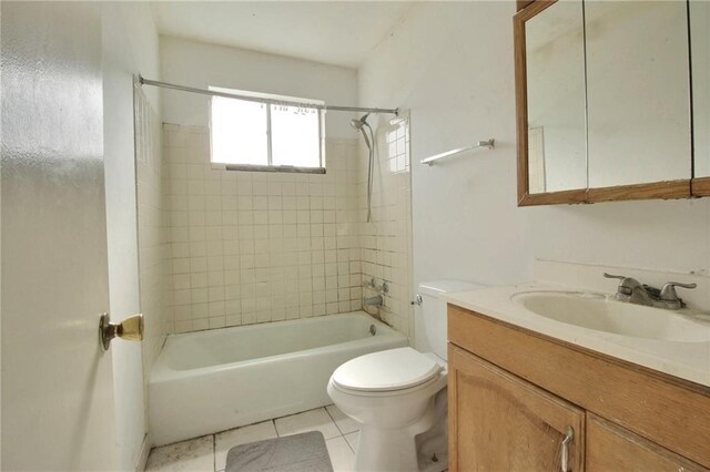 461214 Grammar Ave, Metairie, LA 70001 - bathroom featuring toilet, vanity, washtub / shower combination, and tile patterned flooring