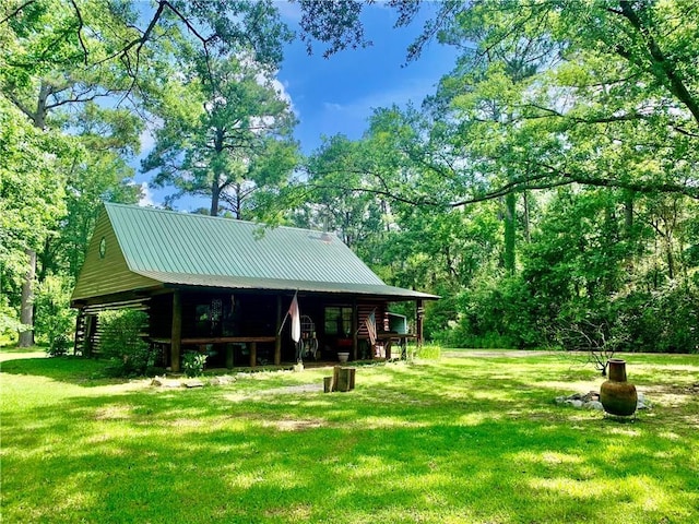 26203 Dove St, Ponchatoula, LA 70454 - view of property's community with a lawn