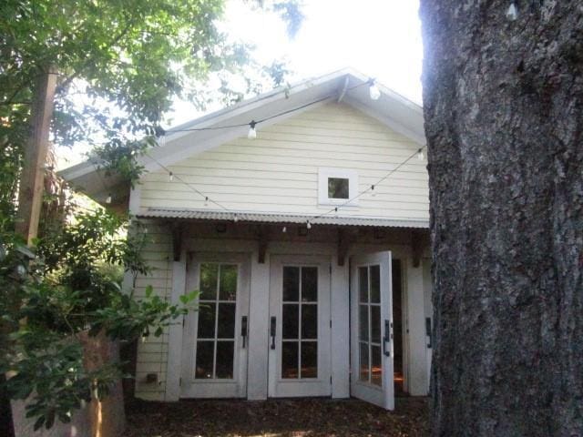 6561 Catina St, New Orleans, LA 70124 - rear view of property featuring french doors
