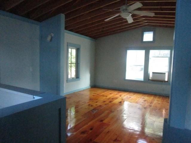 6561 Catina St, New Orleans, LA 70124 - spare room featuring ceiling fan, lofted ceiling, cooling unit, and wood finished floors