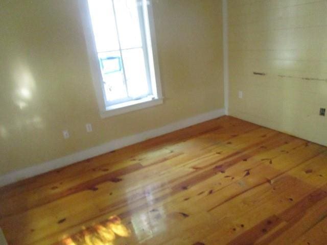 6561 Catina St, New Orleans, LA 70124 - spare room with wood-type flooring and baseboards