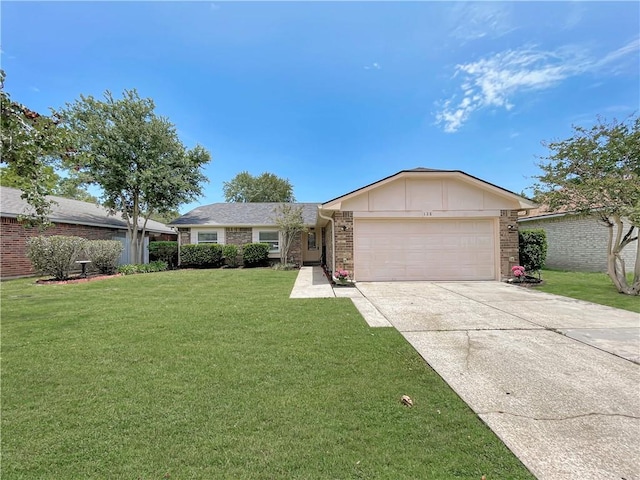 128 Hollowrock Ct, Slidell, LA 70461 - ranch-style house with an attached garage, a front yard, driveway, and brick siding