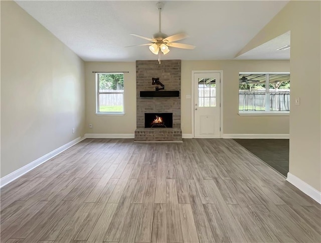 128 Hollowrock Ct, Slidell, LA 70461 - unfurnished living room featuring ceiling fan, plenty of natural light, and wood finished floors
