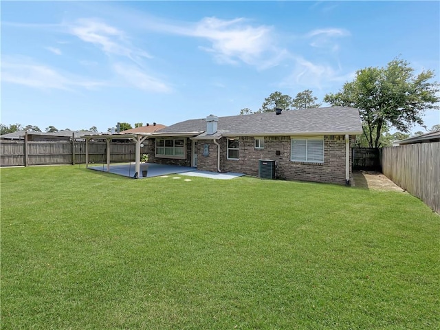 128 Hollowrock Ct, Slidell, LA 70461 - rear view of house with a patio, central AC, and brick siding