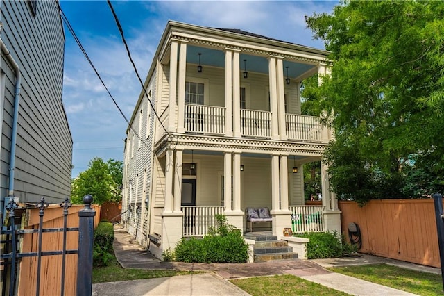2134 Harmony St, New Orleans, LA 70115 - view of front facade featuring covered porch and a balcony