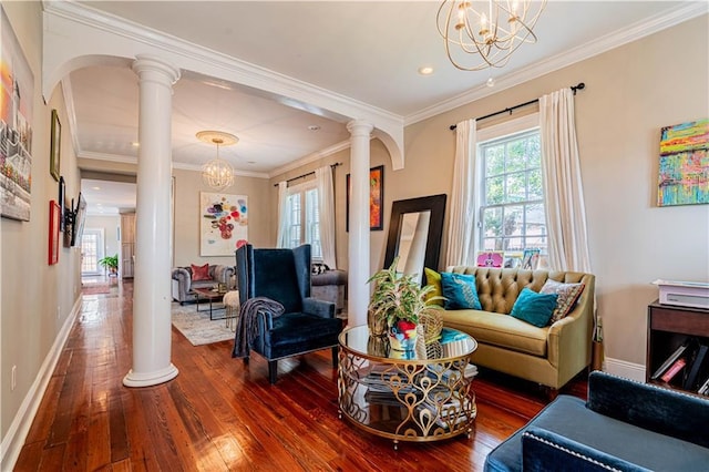 2134 Harmony St, New Orleans, LA 70115 - living room with decorative columns, hardwood / wood-style floors, a chandelier, crown molding, and recessed lighting