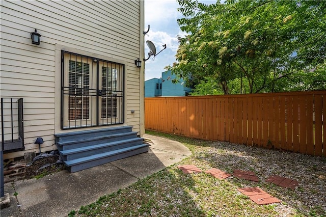 2134 Harmony St, New Orleans, LA 70115 - fenced backyard featuring entry steps