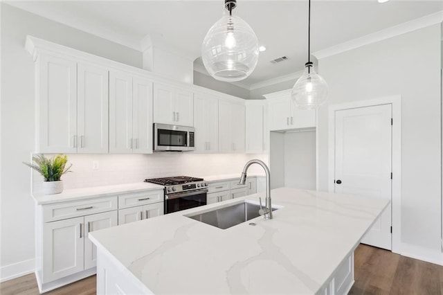 72665 Robindale Dr, Covington, LA 70434 - kitchen with appliances with stainless steel finishes, a sink, white cabinets, and ornamental molding