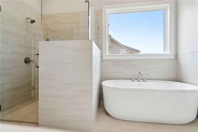 72665 Robindale Dr, Covington, LA 70434 - bathroom featuring a stall shower and a freestanding bath