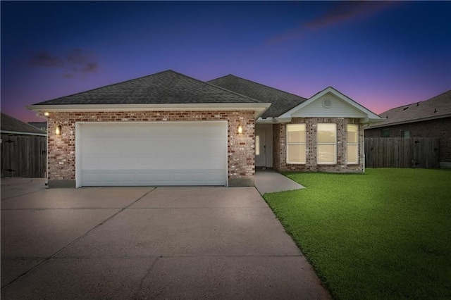 121 Gail Dr, La Place, LA 70068 - single story home featuring driveway, a garage, brick siding, and roof with shingles