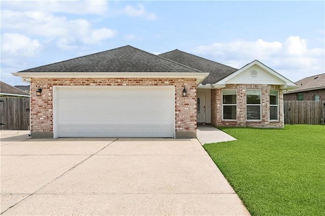 121 Gail Dr, La Place, LA 70068 - single story home with driveway, brick siding, a garage, and roof with shingles