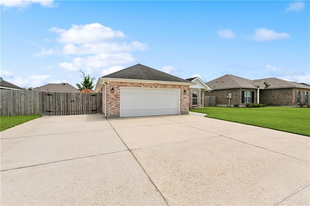121 Gail Dr, La Place, LA 70068 - view of front facade with concrete driveway, brick siding, a gate, an attached garage, and a shingled roof