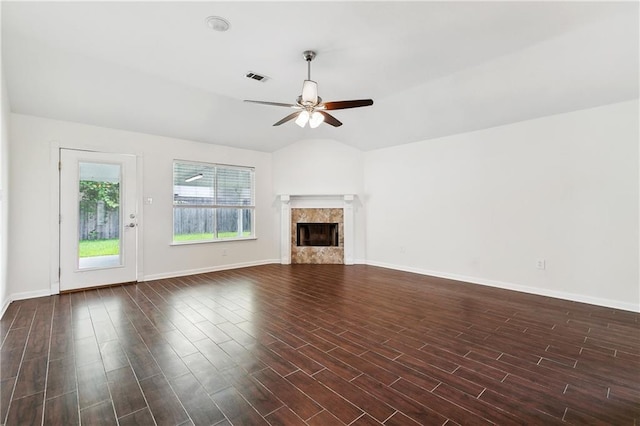 121 Gail Dr, La Place, LA 70068 - unfurnished living room featuring ceiling fan, baseboards, a fireplace, dark wood finished floors, and lofted ceiling