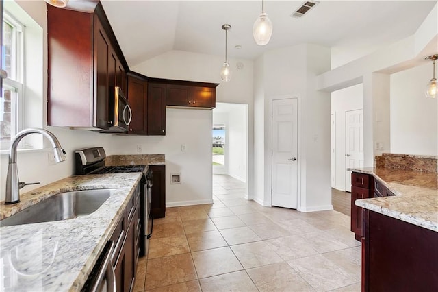 121 Gail Dr, La Place, LA 70068 - kitchen with a sink, stainless steel appliances, light stone countertops, pendant lighting, and vaulted ceiling