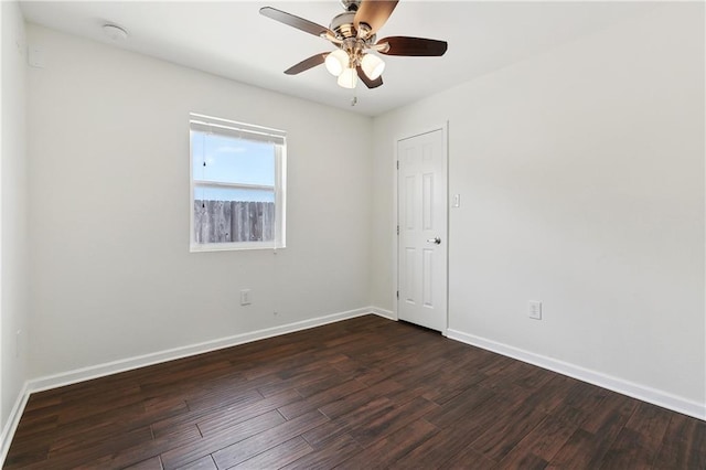 121 Gail Dr, La Place, LA 70068 - spare room featuring dark wood finished floors, ceiling fan, and baseboards
