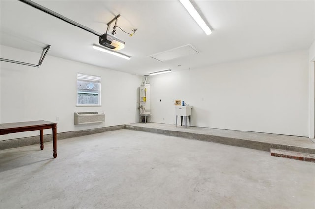 121 Gail Dr, La Place, LA 70068 - garage featuring a garage door opener, water heater, and a wall mounted air conditioner