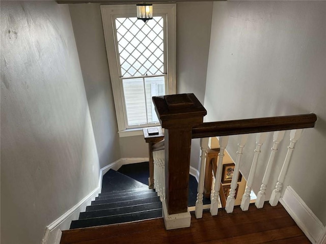 1228 Pine St, New Orleans, LA 70118 - stairs with wood finished floors and baseboards