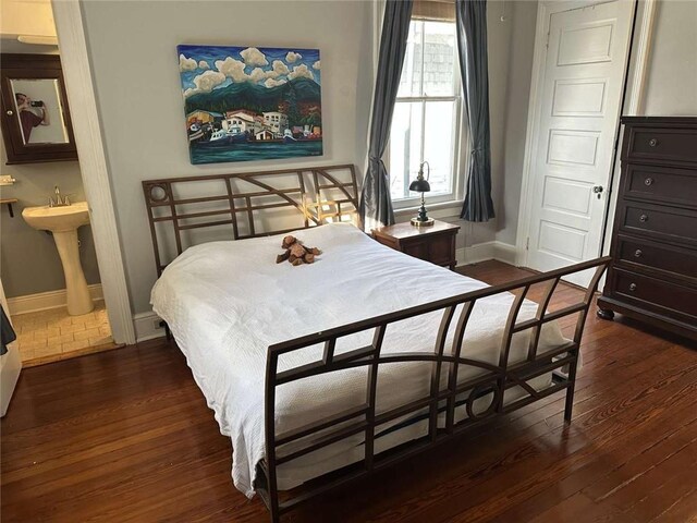 1228 Pine St, New Orleans, LA 70118 - bedroom with wood-type flooring and baseboards