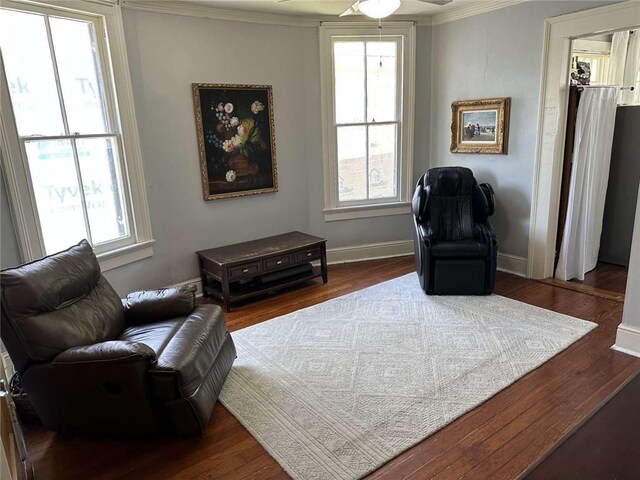 1228 Pine St, New Orleans, LA 70118 - sitting room with crown molding, healthy amount of natural light, ceiling fan, wood finished floors, and baseboards