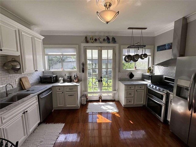 1228 Pine St, New Orleans, LA 70118 - kitchen featuring stainless steel appliances, a sink, plenty of natural light, french doors, and crown molding