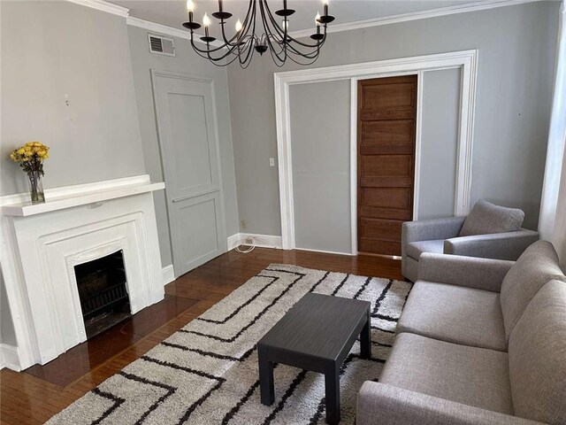 1228 Pine St, New Orleans, LA 70118 - living area with a chandelier, crown molding, wood finished floors, and baseboards