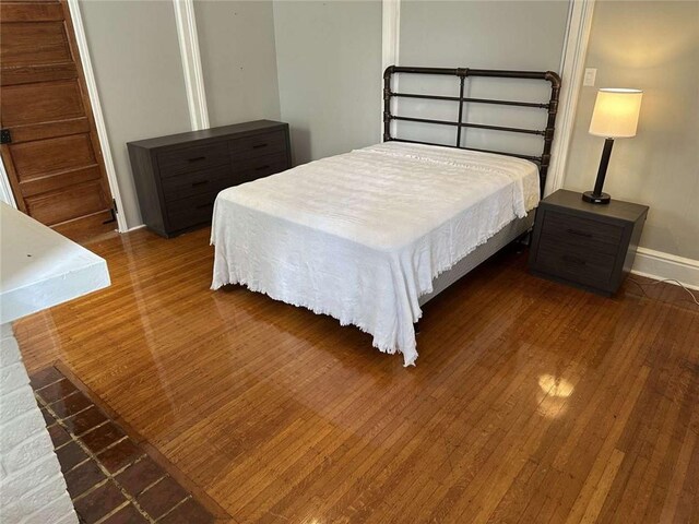 1228 Pine St, New Orleans, LA 70118 - bedroom with wood finished floors and baseboards