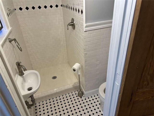 1228 Pine St, New Orleans, LA 70118 - full bathroom with toilet, a shower stall, tile patterned floors, and a sink