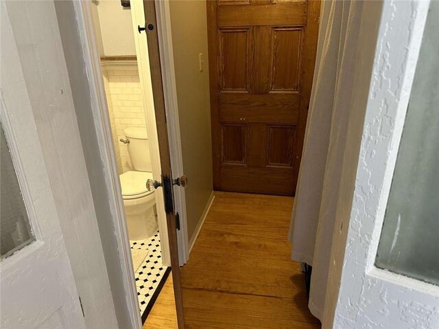 1228 Pine St, New Orleans, LA 70118 - hallway with light wood-type flooring