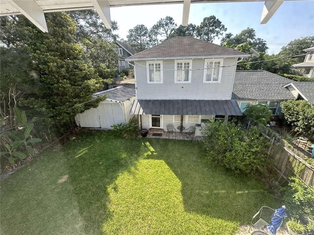 1228 Pine St, New Orleans, LA 70118 - rear view of house with roof with shingles
