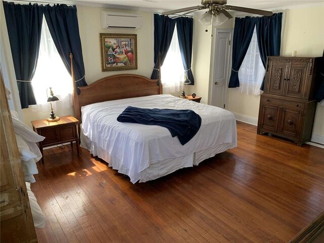 1228 Pine St, New Orleans, LA 70118 - bedroom with a wall mounted AC, wood-type flooring, multiple windows, and ceiling fan