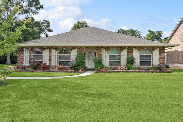 335 Devon Rd, La Place, LA 70068 - bungalow featuring a chimney, brick siding, and a shingled roof
